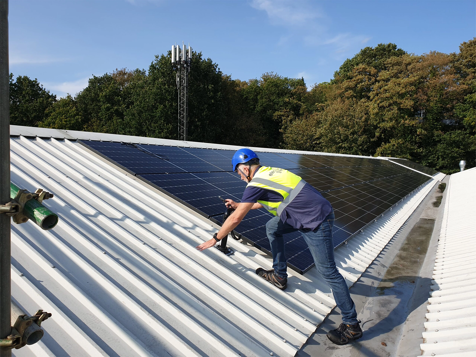 Worker installing solar panels